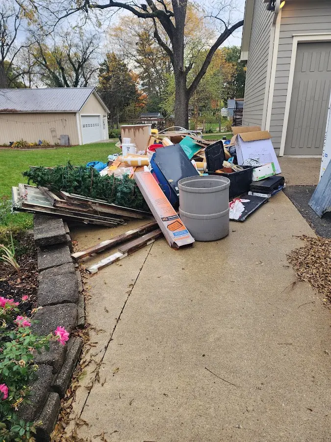 Dumpster being loaded with debris for Commercial Dumpster Rental in Rolesville